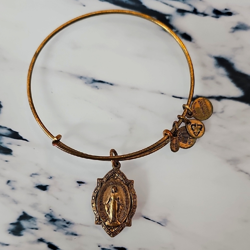 Alex and Ani gold bangle bracelet with Mother Mary charm